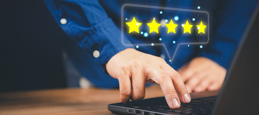 Homeowner presses button on a computer to leave Heiden a five-star review.